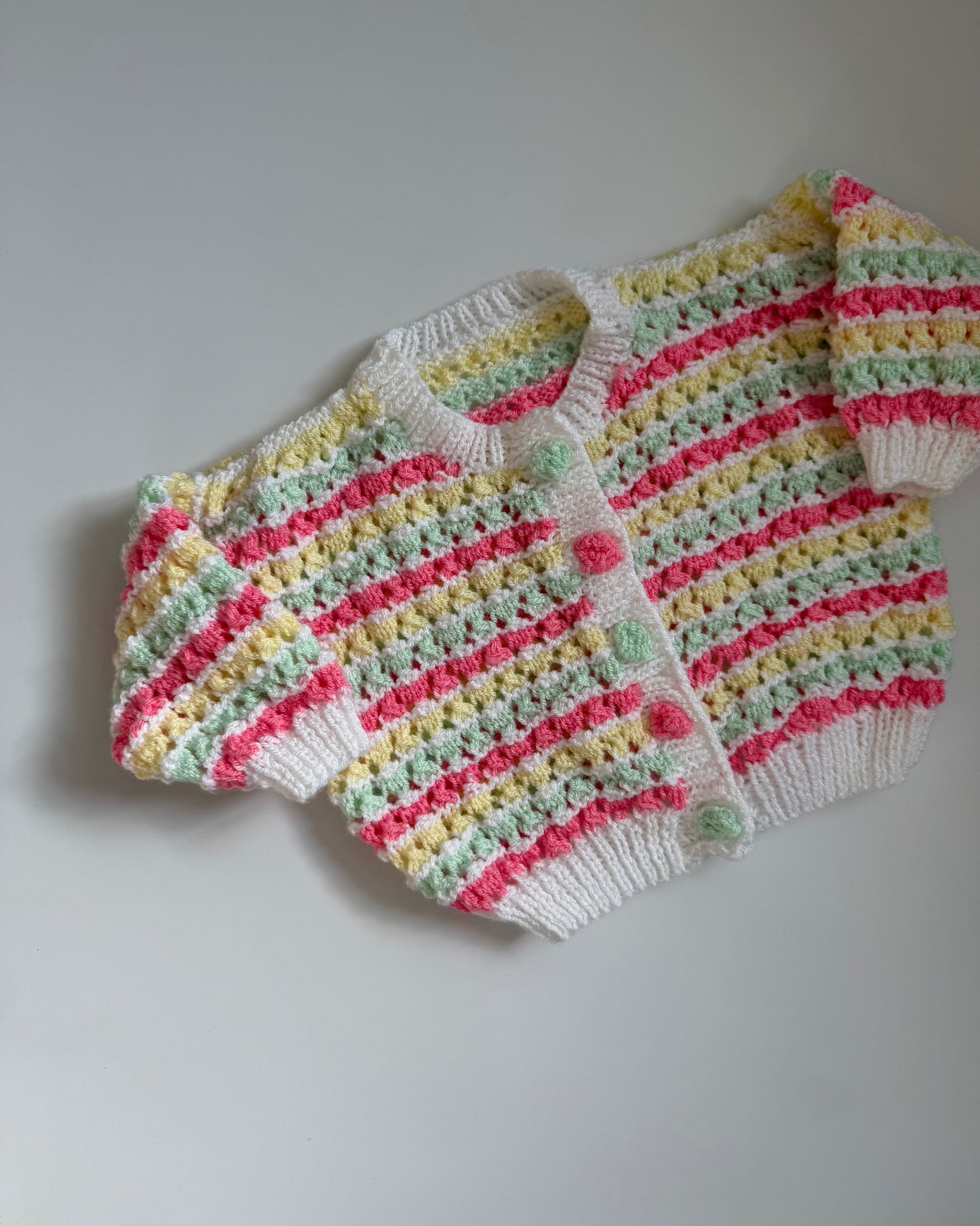 Hand-knitted pastel stripe cardigan bobble buttons 6–12m