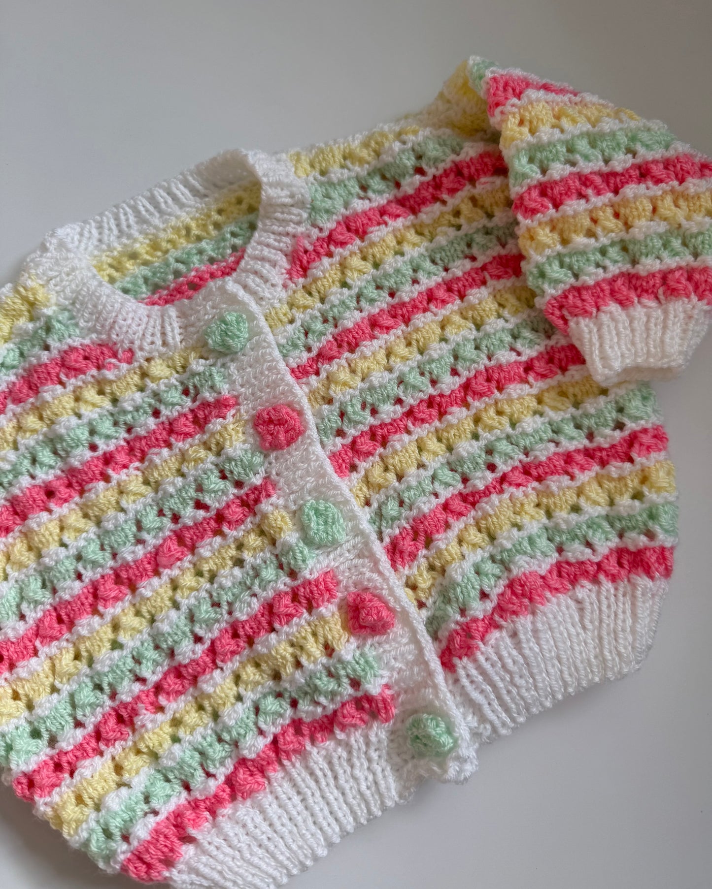 Hand-knitted pastel stripe cardigan bobble buttons 6–12m